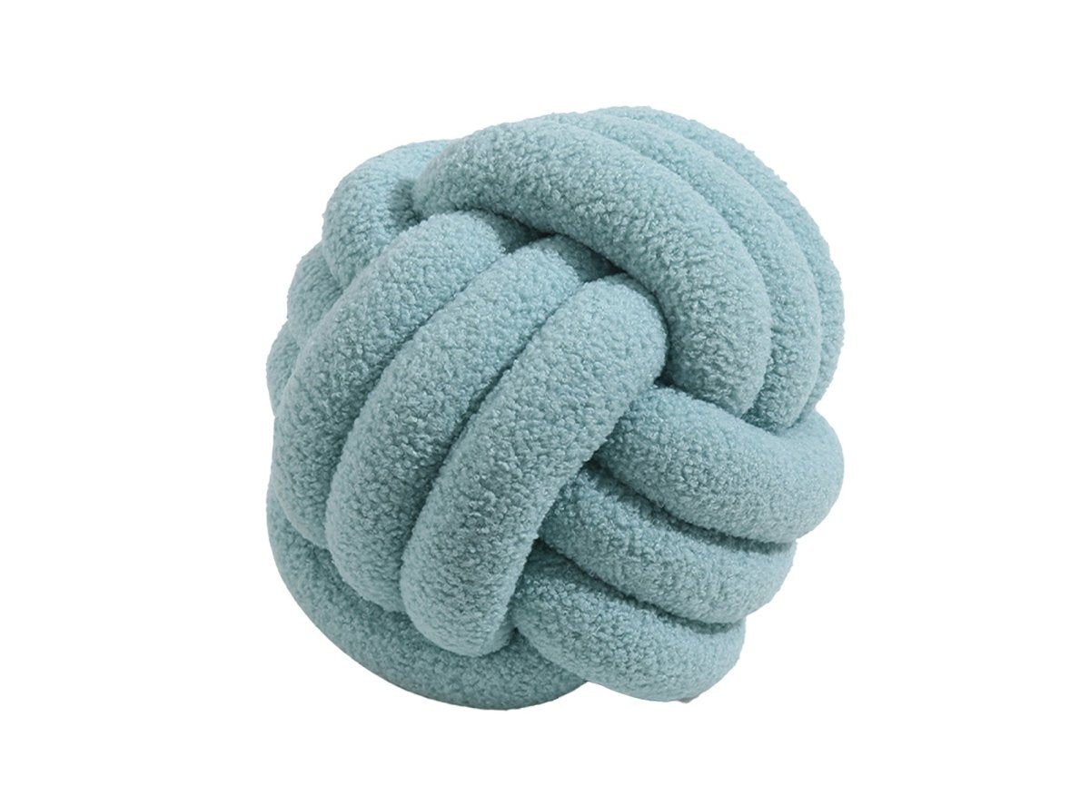 Coussin rond décoratif boule de nœud en effet peau de mouton bleu NODUS - DécoInParis